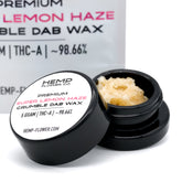 Open container of Super Lemon Haze THCA Crumble Wax with yellow hemp flower crumble